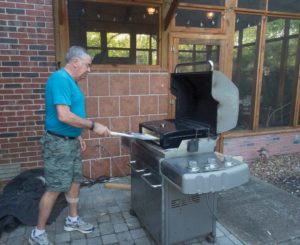 Chef Bob dueling with his famous pizza oven. He won this time!